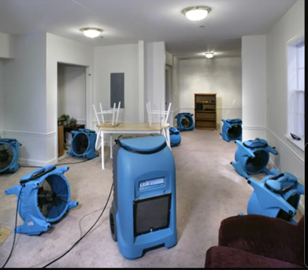 Air movers and dehumidifier setup for Water Damage Restoration in Watertown